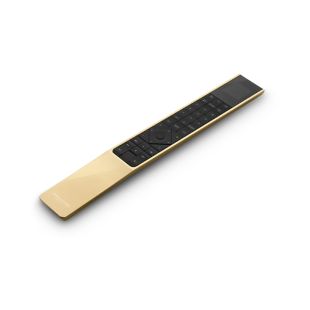 Bang & Olufsen BeoRemote One juhtpult on Bluetooth ühendusega, pulti ümbritseb kuldne alumiinium
